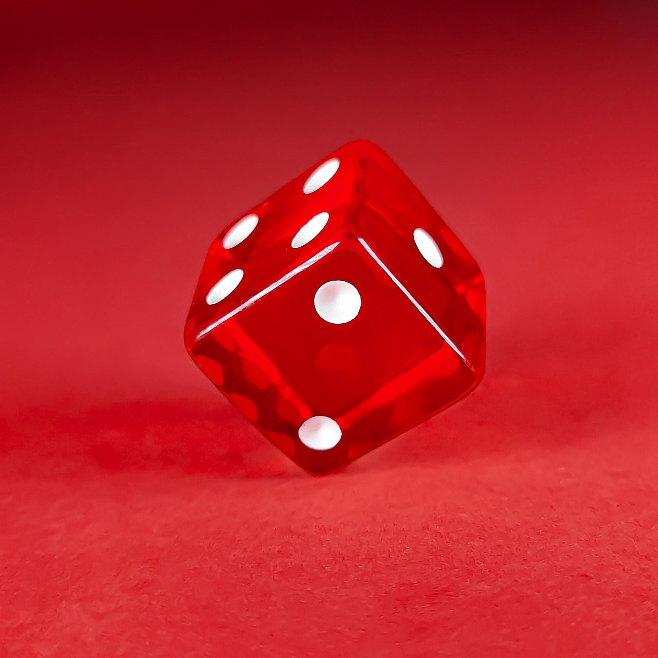 Red dice on a red background